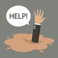 Businessman hand sinking in a puddle of quicksand