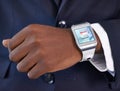 Businessman, hand and smart watch on wrist for digital agenda, online schedule and high tech for job. Black man, arm and Royalty Free Stock Photo