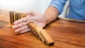 businessman hand stop dominoes continuous toppled or risk with c Royalty Free Stock Photo