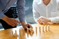 Businessman hand stopping the domino effect. executive and risk Royalty Free Stock Photo