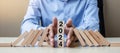 Businessman hand Stopping Falling of 2024 wooden Blocks. Business, Risk Management, Insurance, Resolution, strategy, solution, Royalty Free Stock Photo