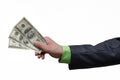 Businessman hand is stretching a dollars money isolated on gray background with copy space background. Financial help. Bribe and c Royalty Free Stock Photo
