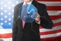 Businessman hand touch a vote button Royalty Free Stock Photo