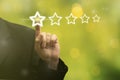 Businessman hand touching on five star excellent rating, leave feedback. 5 star symbol to increase rating of company. Business Royalty Free Stock Photo