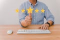 Businessman hand touching five star symbol to increase rating of company concept Royalty Free Stock Photo