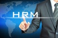 Businessman hand touching HRM (Human Resources Management) sign Royalty Free Stock Photo
