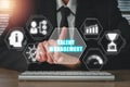 Businessman hand touching talent management icon on virtual screen Royalty Free Stock Photo
