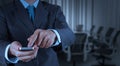 Businessman hand use smart phone computer with email icon as con Royalty Free Stock Photo