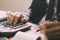 Businessman hand using calculator Calculating bonus