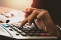 businessman hand using calculator Calculating bonus