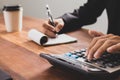 businessman hand using calculator Calculating bonus Royalty Free Stock Photo