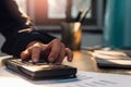 Businessman hand using calculator Calculating bonusOr other compensation to employees to increase productivity, work from home,