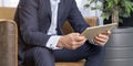 Businessman hand using digital tablet in office meeting room. Male entrepreneur reading news on social media app. Online marketing Royalty Free Stock Photo