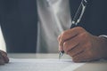 Businessman hand using pen signing on new contract starting projects in conference room. Close up business manager man hands sign Royalty Free Stock Photo