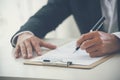 Businessman hand using pen signing on new contract starting projects in conference room. Close up business manager man hands sign Royalty Free Stock Photo