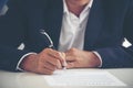 Businessman hand using pen signing on new contract starting projects in conference room. Close up business manager man hands sign Royalty Free Stock Photo