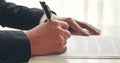 Businessman hand using pen signing on new contract to starting projects in conference room. Close up business manager man hands Royalty Free Stock Photo