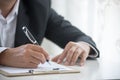 Businessman hand using pen signing on new contract to starting projects in conference room. Close up business manager man hands Royalty Free Stock Photo