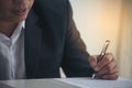 Businessman hand using pen signing on new contract to starting projects in conference room. Close up business manager man hands Royalty Free Stock Photo