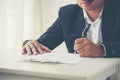 Businessman hand using pen signing on new contract to starting projects in conference room. Close up business manager man hands Royalty Free Stock Photo