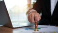 Businessman hand using wooden stamping to document approve and reject document or project, Signing a business contract approval of Royalty Free Stock Photo