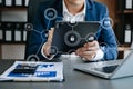 Businessman hand working digital marketing media in virtual screen with mobile phone and modern compute with VR icon diagram at Royalty Free Stock Photo