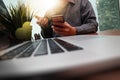 businessman hand working with new modern computer and smart phone and business strategy on wooden desk as concept Royalty Free Stock Photo