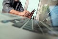 businessman hand working with new modern computer and smart phone and business strategy on wooden desk as concept Royalty Free Stock Photo