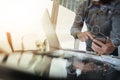 businessman hand working with new modern computer and smart phone and digital business strategy on wooden desk with calculator Royalty Free Stock Photo