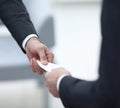 Businessman handing business card to the partner. Royalty Free Stock Photo