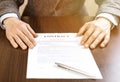 Businessman handing over a contract for signature offering a ballpoint pen Royalty Free Stock Photo