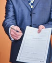 Businessman handing over the contract to sign