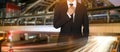 Businessman handles necktie showing confidence in the big city.