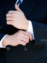 Businessman hands adjusting shirt cuff