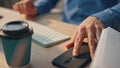 Businessman hands answering telephone call cabinet closeup. Man picking up phone