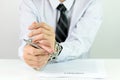 Businessman hands with chains and contract Royalty Free Stock Photo