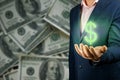 Businessman hands on dark background of us dollar banknotes holding glowing dollar sign. Hand of businessman holding money bag Royalty Free Stock Photo