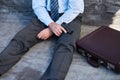 Businessman, hands and gun with suicide, stress and depression on ground with suitcase for risk or problem. Professional Royalty Free Stock Photo