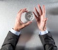 Businessman hands holding a compass searching for a management strategy