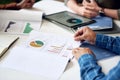 businessman hands holding financial document discussing data with colleagues in meeting brainstorming ideas using graph Royalty Free Stock Photo