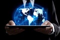 Businessman hands holding tablet with glowing planet earth globe hologram with points and lines. Communication, network, science Royalty Free Stock Photo