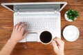 Businessman hands on laptop drinking coffee. Royalty Free Stock Photo