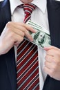 Businessman, hands and money bribe in pocket for fraud, scam or secret on a white studio background. Closeup of employee Royalty Free Stock Photo