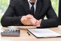 Businessman hands pain on desk office syndrome concept.