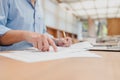 Businessman hands point paper graph and checking document data calculator for calculate budget accountancy. finance and accounting Royalty Free Stock Photo