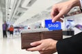 Businessman hands pulling money Shopping concept on brown wallet