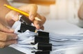 Businessman hands searching and checking write unfinished documents stacks of paper files on office desk for report papers with Royalty Free Stock Photo