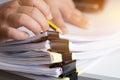 Businessman hands searching unfinished documents stacks of paper files on office desk for report papers, piles of papers sheet Royalty Free Stock Photo