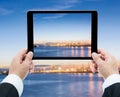 Businessman hands tablet taking pictures Commercial docks at sun Royalty Free Stock Photo