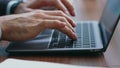 Businessman hands texting laptop making notes in notebook close up. Man typing Royalty Free Stock Photo